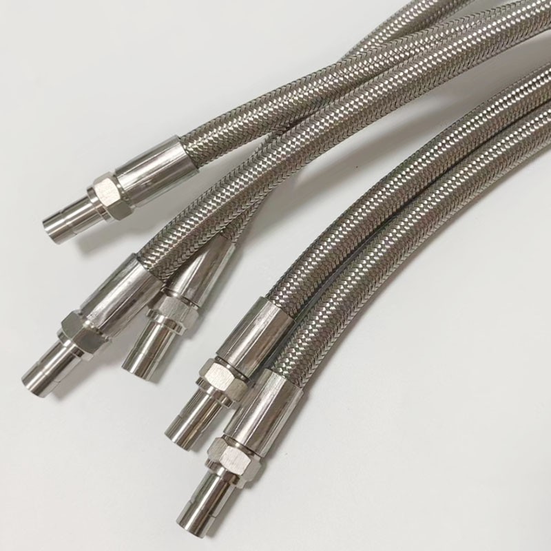 Коррозионностойкий соединительный патрубок из ПТФЭ/ПТФЭ 304 с тефлоновой оплеткой