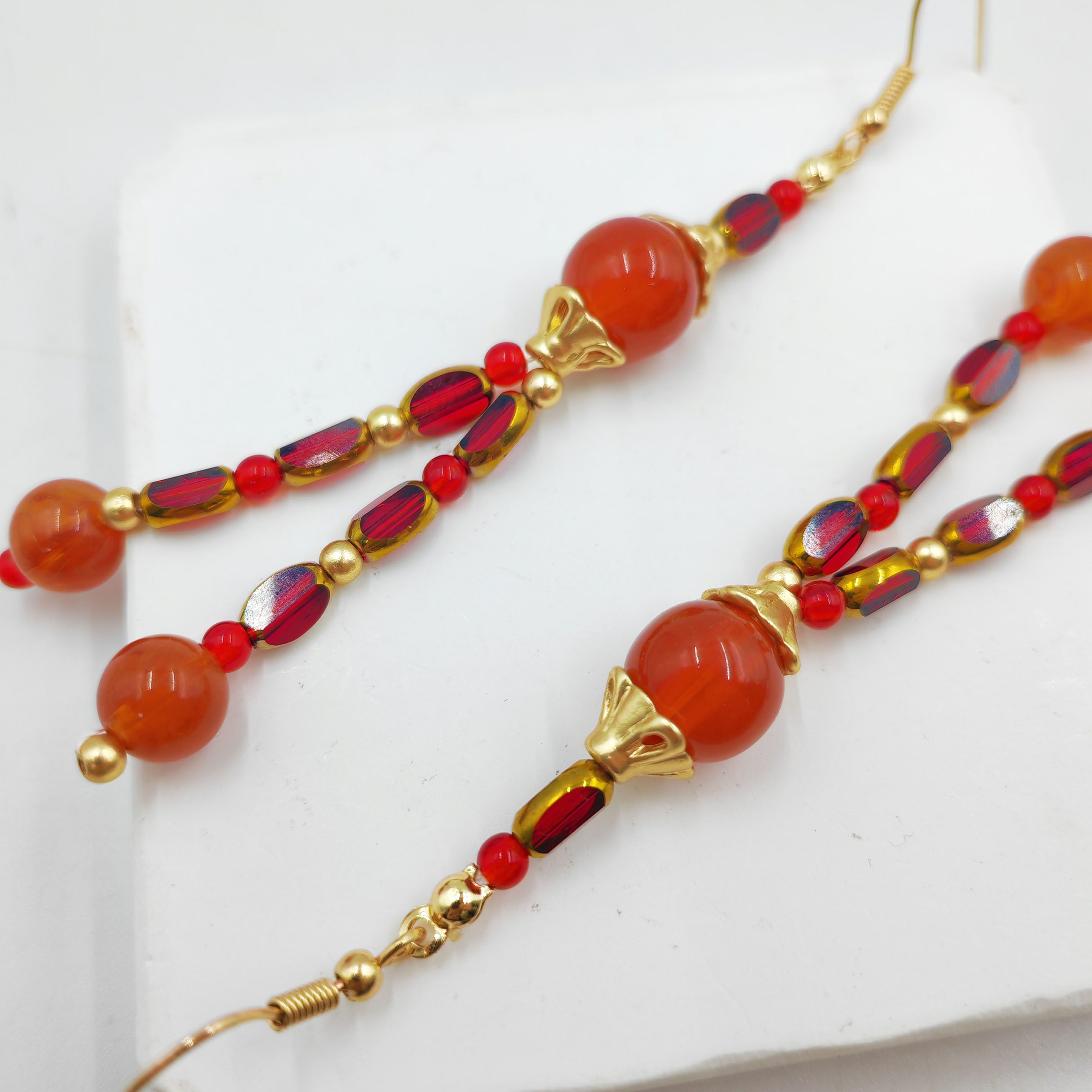 Круглый кулон с кисточкой